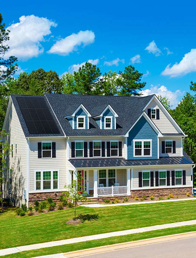 Residential home with solar panel installation by Wolf River Construction, showcasing sustainable energy solutions for modern living.