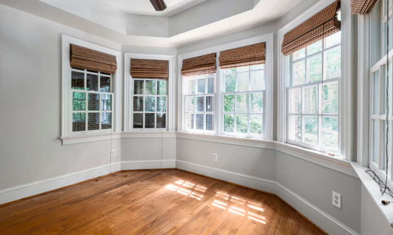 Bay windows installed by Wolf River Construction, enhancing natural light and energy efficiency in a modern interior space.