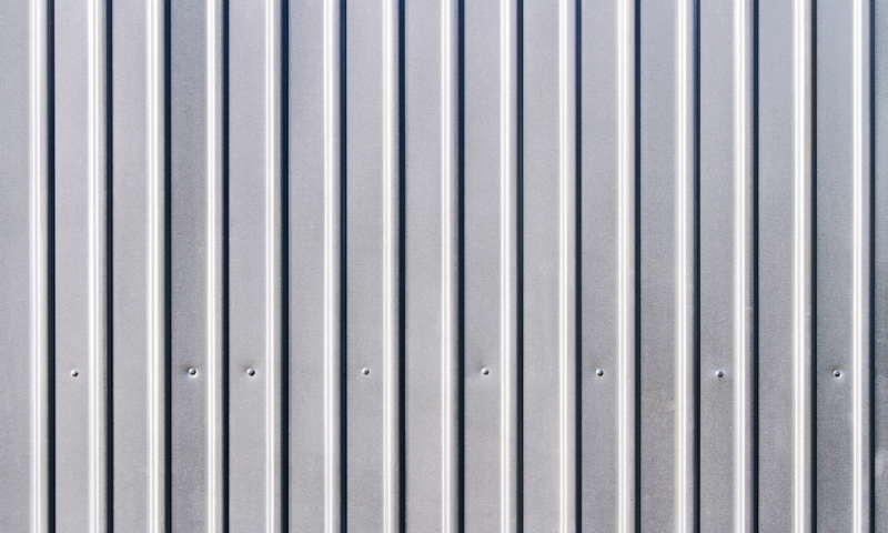 Close-up of vertical metal siding installed by Wolf River Construction, highlighting durable and modern exterior solutions.