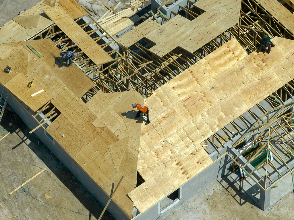 Construction site with roofing in progress by Wolf River Construction, specializing in expert building and sustainable solutions.