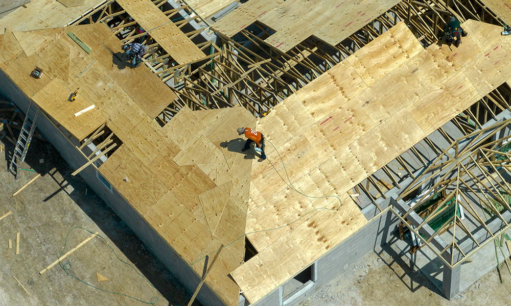 Residential roofing construction in progress by Wolf River Construction, showcasing expert craftsmanship and durable building solutions.